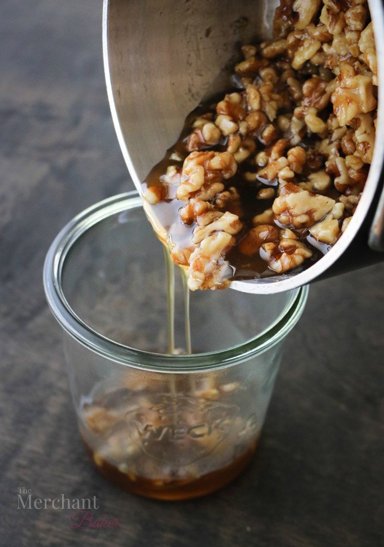 Pouring walnut syrup into a glass container