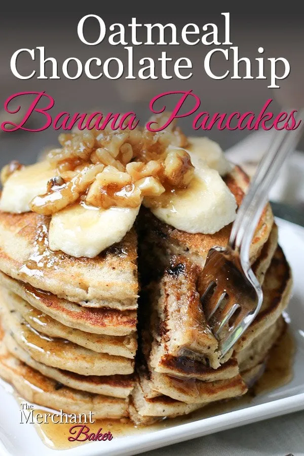 Pinterest Image Stack of Oatmeal Chocolate Chip Banana Pancakes speared with a fork topped with sliced bananas and walnut syrup from themerchantbaker.com
