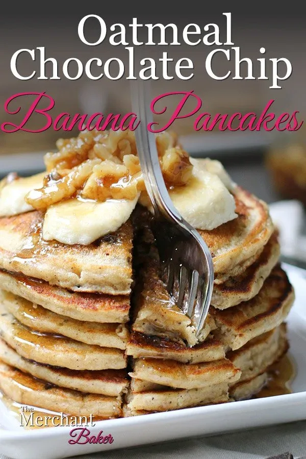 Pinterest Image Stack of Oatmeal Chocolate Chip Banana Pancakes speared with a fork topped with sliced bananas and walnut syrup from themerchantbaker.com