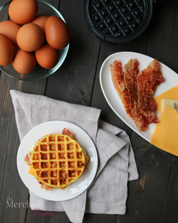 An overhead photo of Basic Chaffles made into a bacon, egg and cheese sandwich by themerchantbaker.com