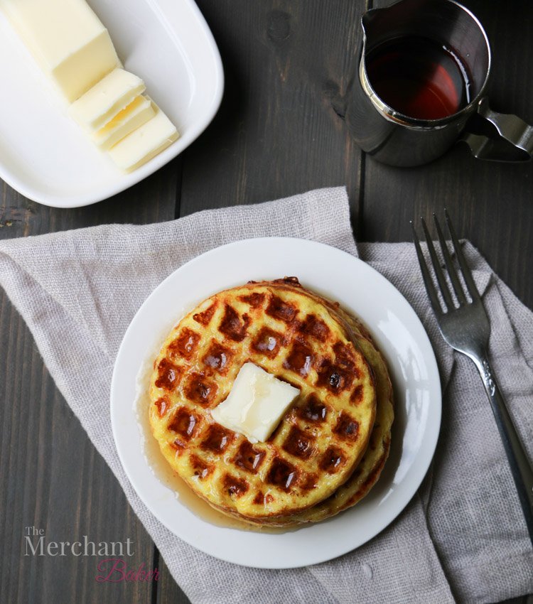  Overhead photo of Maple Waffle Chaffles on a plate with a pat of butter with syrup by themerchantbaker.com