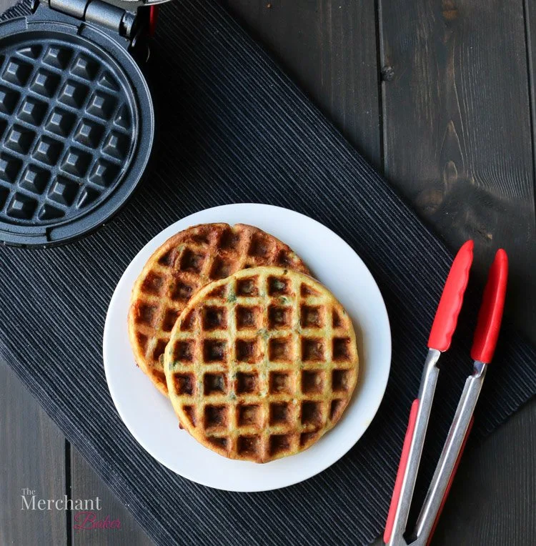 An overhead photo of two Low Carb Stuffing Chaffles on a place mat by themerchantbaker.com