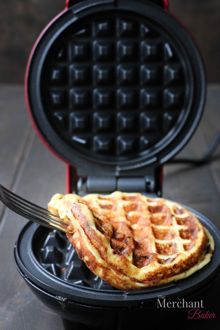 A fork removing a chaffle from a waffle iron