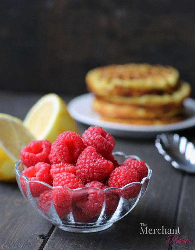Bowl of raspberries for Lemon Ricotta Poppyseed Chaffles by themerchantbaker.com