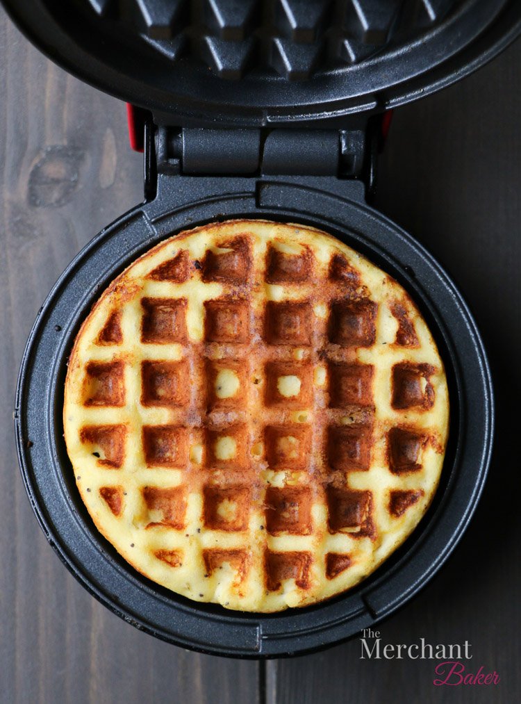 Overhead view of a cooked waffle in a waffle iron