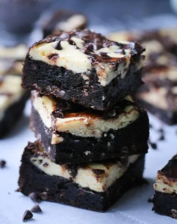 Three stacked brownies by themerchantbaker.com