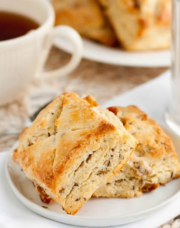 Two Irish Soda Bread Scones on a white plate by themerchantbaker.com