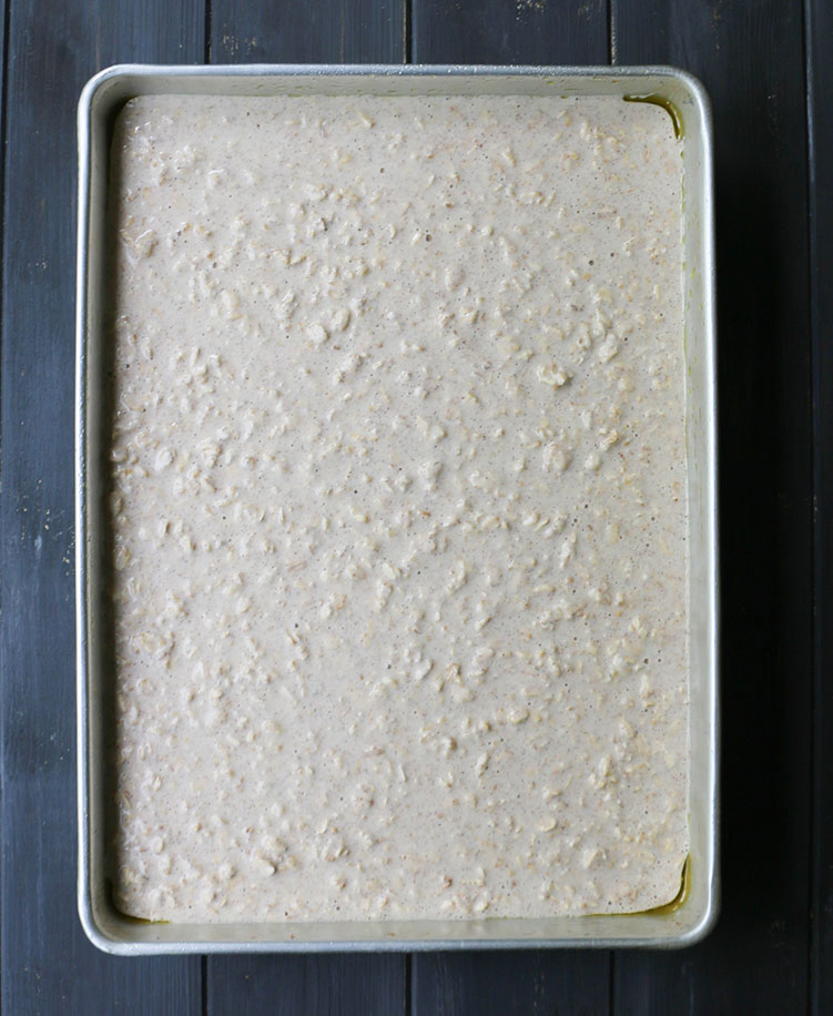 Overhead view of Big Batch Oatmeal batter in baking pan before baking