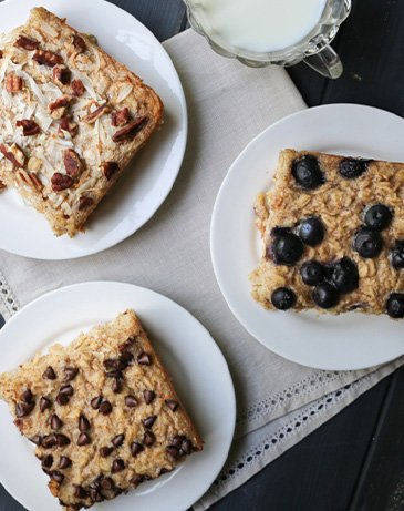 Three slices of Baked Oatmeal on white plates by themerchantbaker.com