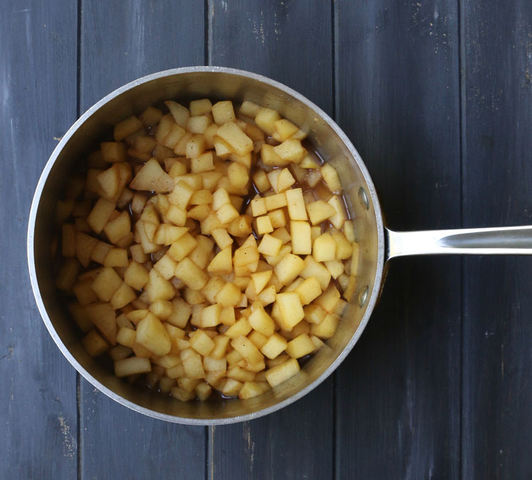 An overhead photo of diced apples in a sauce panCooked diced apples in a sauce pan by themerchantbaker.com
