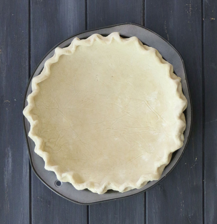 overhead photo of an unbaked all butter pie crust
