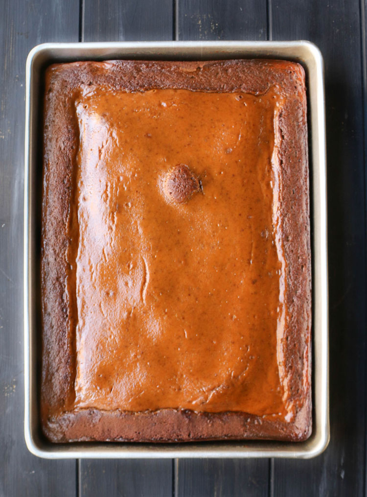 overhead view of the full pan of baked pumpkin pie gingerbread cake.