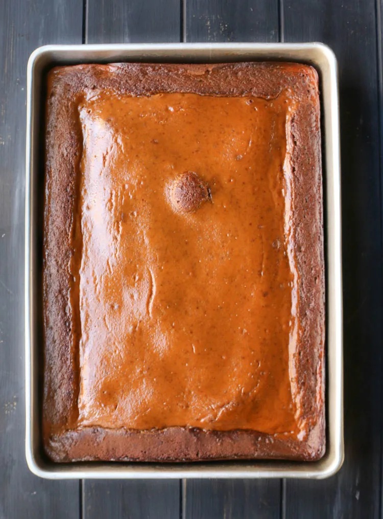 overhead view of the full pan of baked pumpkin pie gingerbread cake.