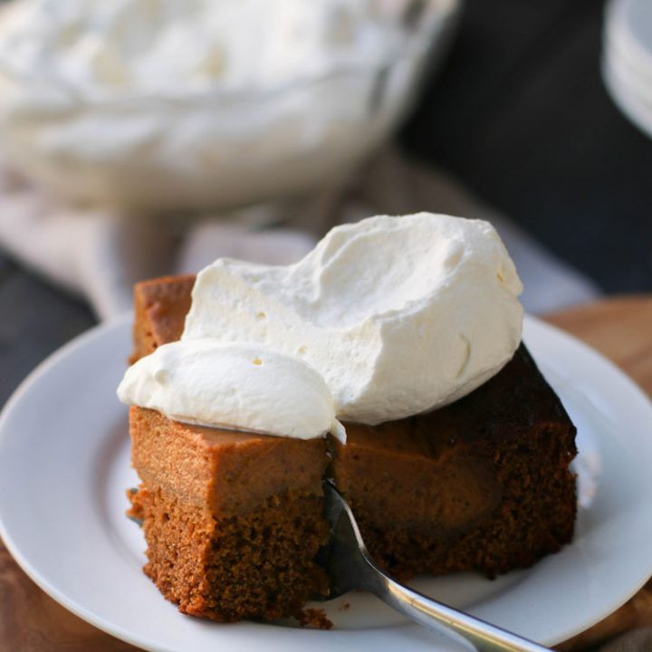close up photo of a fork cutting into a piece of pumpkin pie gingerbread cake