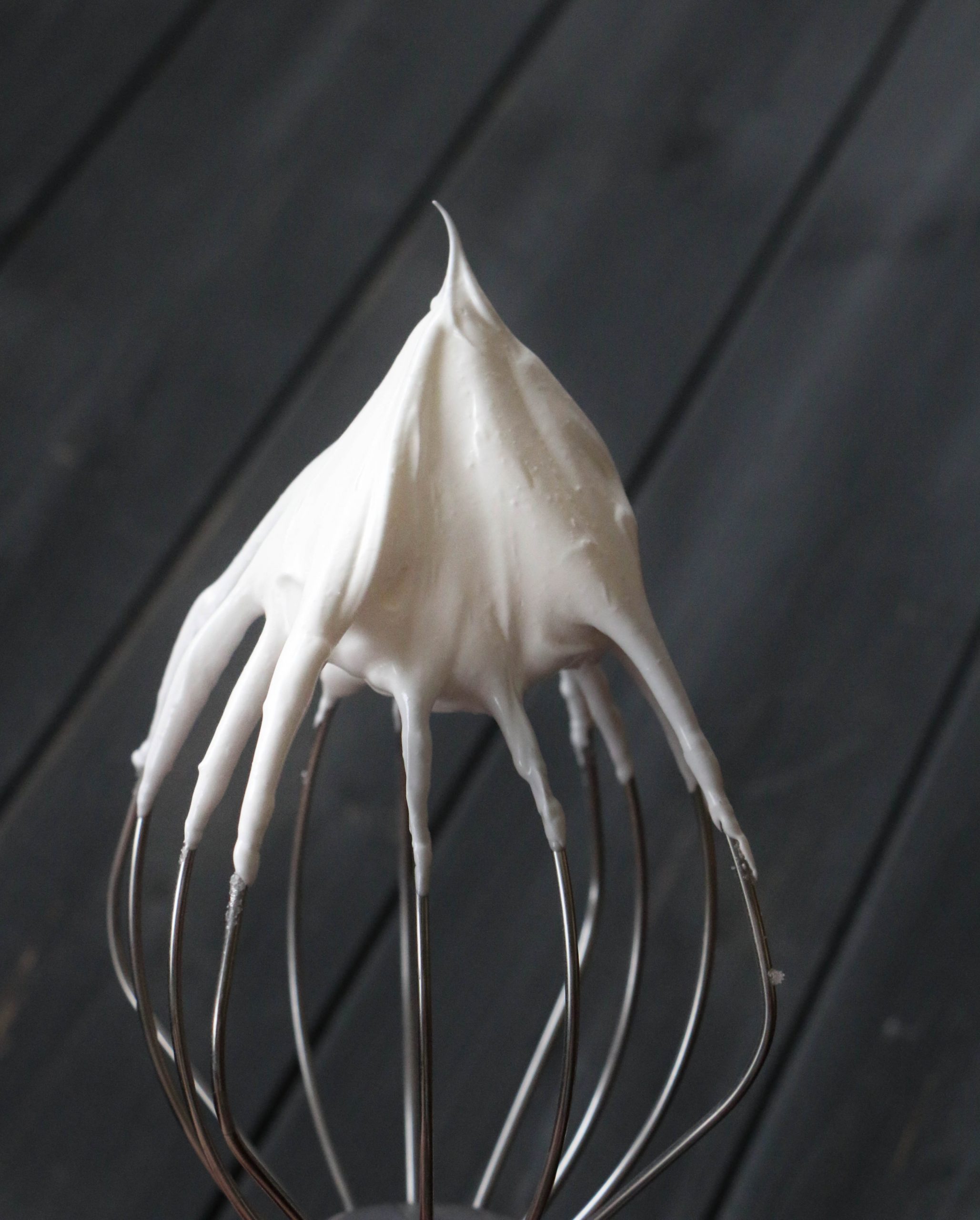 stiff meringue peak on the end of a whisk