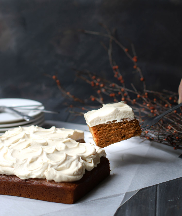 A slice of Crazy Pumpkin Olive Oil Cake being lifted up with a spatula