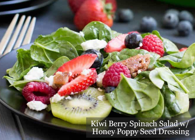 Kiwi Berry Spinach Salad with Honey Poppy Seed Dressing on a black plate