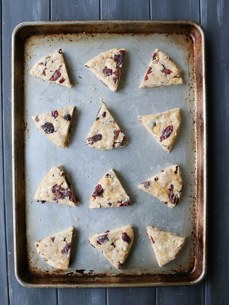 An overhead photo of unbaked Cherry Almond Scones on a baking sheet.