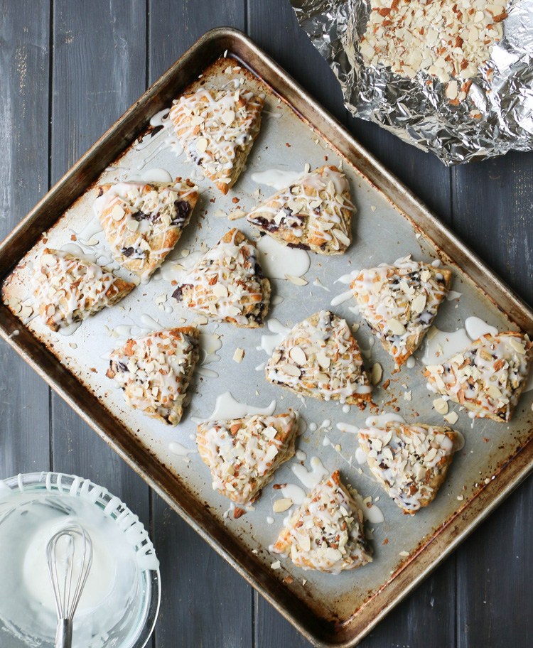 Overhead photo of Iced Cherry Almond Scones on a baking sheet