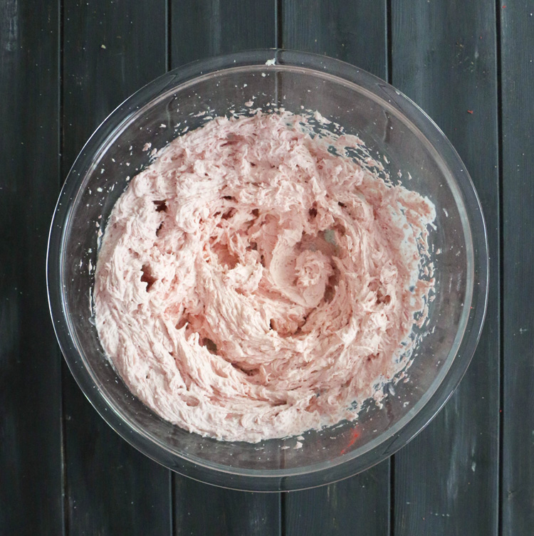 Strawberry Whipped Cream Cream Cheese Frosting in a glass bowl